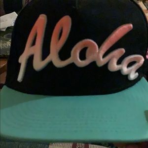 Fitted— black and teal hat w/ orange ombré “aloha”